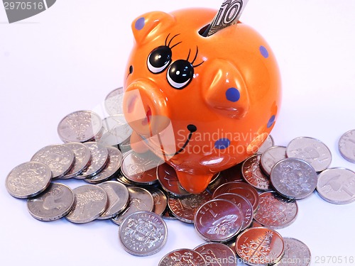 Image of Bunch of coins and piggy bank