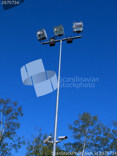 Image of Stadium light against blue sky