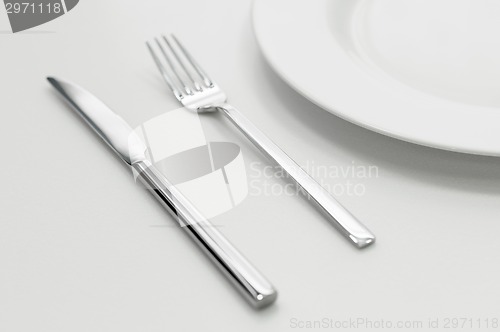 Image of Place setting with plate, knife and fork