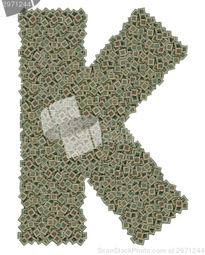 Image of letter K made of old and dirty microprocessors