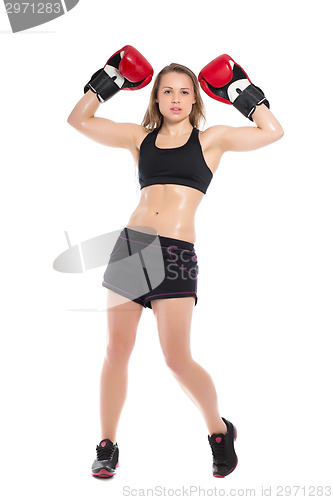 Image of Young woman posing with boxing gloves