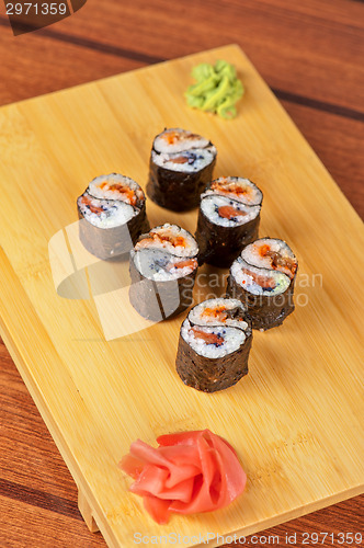 Image of sushi rolls with tobico and pancake