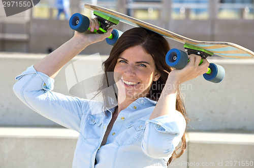 Image of Goofy girl with skateboard