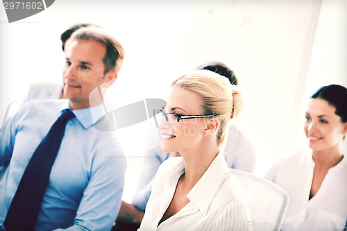 Image of businessmen and businesswomen on conference