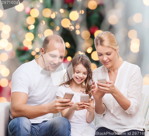 Image of happy family with smartphones