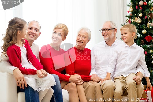 Image of smiling family at home