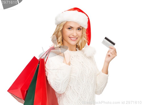 Image of woman with shopping bags and credit card