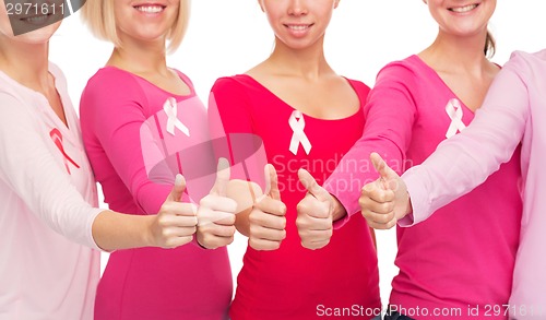 Image of close up of women with cancer awareness ribbons