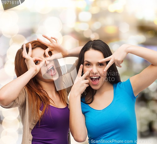 Image of smiling teenage girls having fun