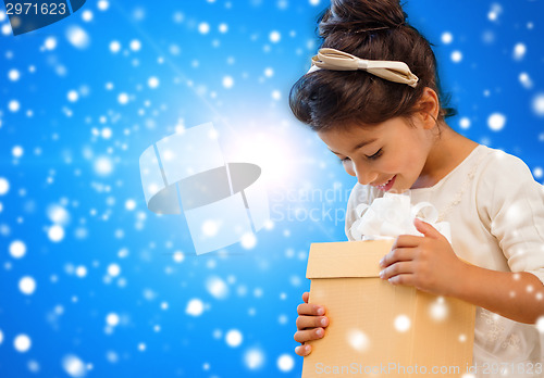 Image of smiling little girl with gift box