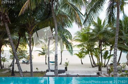 Image of swimming pool on tropical beach