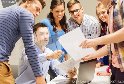 Image of group of students and teacher with laptop