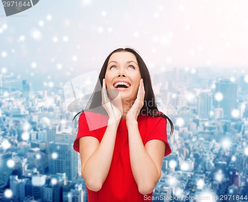 Image of smiling woman in red dress