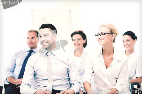 Image of businessmen and businesswomen on conference