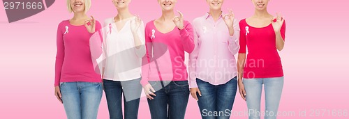 Image of close up of women with cancer awareness ribbons