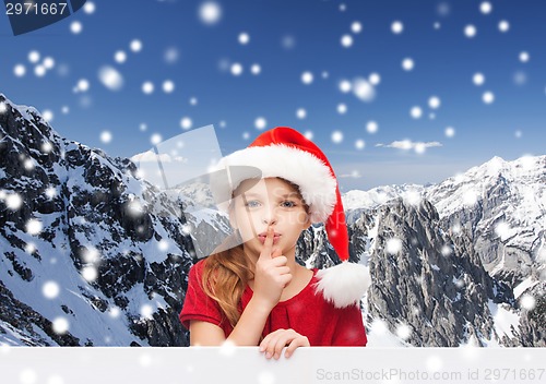 Image of smiling little girl in santa helper hat