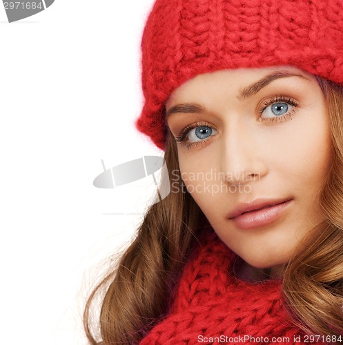 Image of close up of smiling young woman in winter clothes