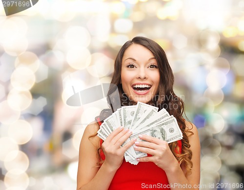 Image of woman in red dress with us dollar money