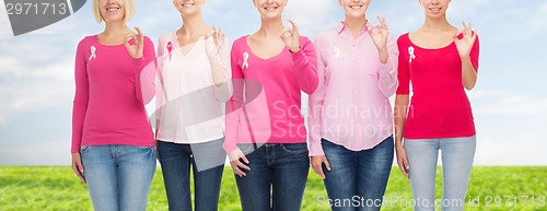 Image of close up of women with cancer awareness ribbons