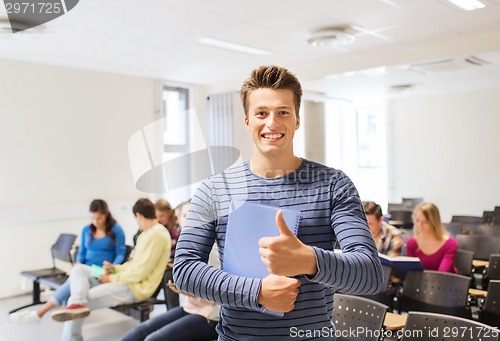 Image of group of smiling students in lecture hall