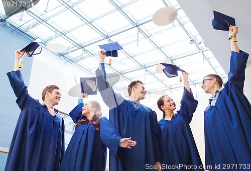 Image of group of smiling students in mortarboards