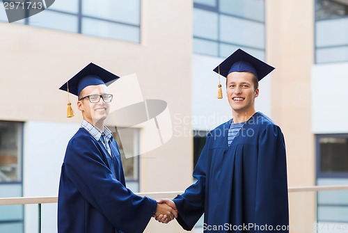 Image of smiling students in mortarboards