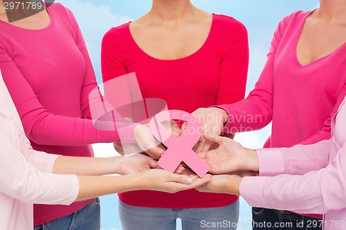 Image of close up of women with cancer awareness ribbons