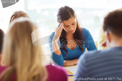 Image of group of students with papers