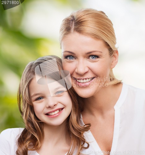 Image of smiling mother and little girl