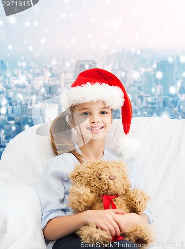 Image of smiling little girl with teddy bear
