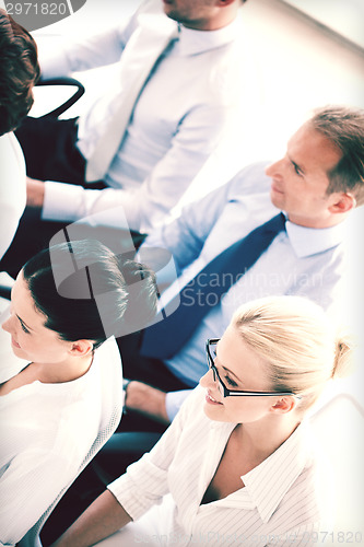 Image of businessmen and businesswomen on conference