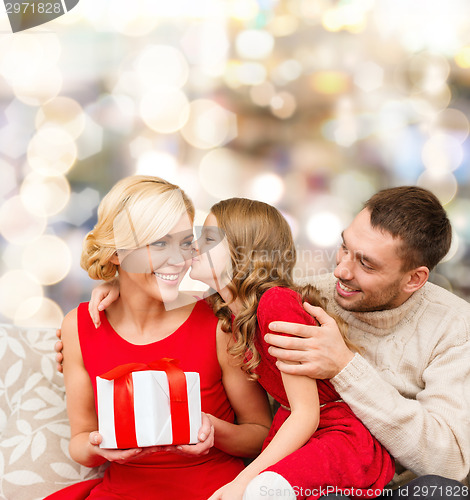 Image of happy family with gift box