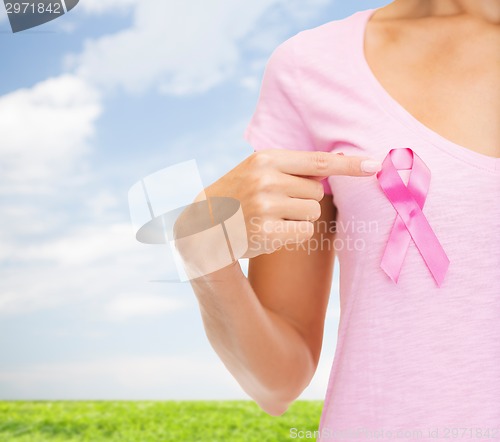 Image of close up of woman with cancer awareness ribbon