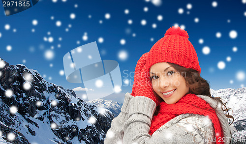 Image of smiling young woman in winter clothes