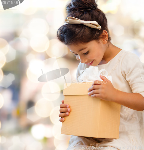 Image of smiling little girl with gift box