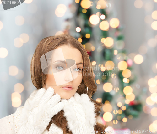 Image of smiling young woman in winter clothes