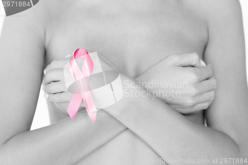 Image of naked woman with breast cancer awareness ribbon