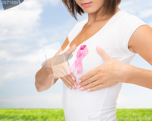 Image of close up of woman with cancer awareness ribbon