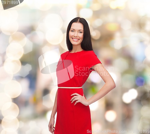 Image of smiling woman in red dress