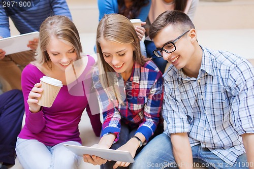 Image of group of students with tablet pc and coffee cup