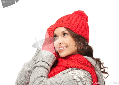 Image of beautiful asian woman in hat, scarf and mittens