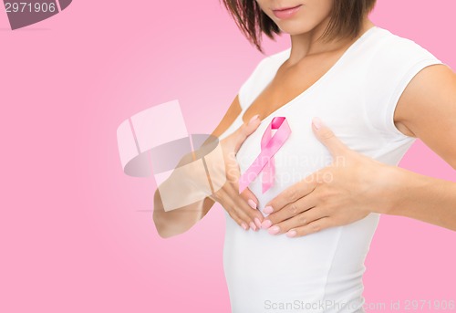 Image of close up of woman with cancer awareness ribbon