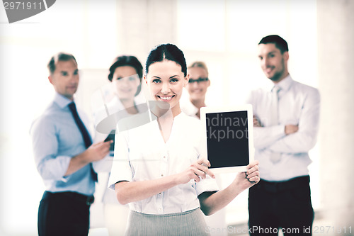 Image of businesswoman with tablet pc in office