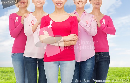 Image of close up of women with cancer awareness ribbons