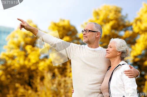 Image of senior couple hugging in park