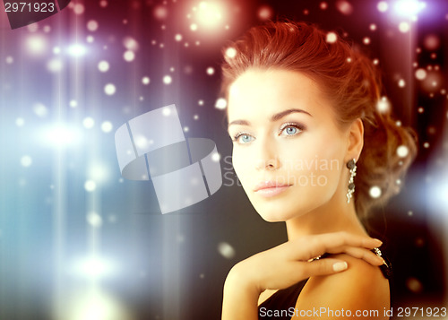 Image of woman with diamond earrings