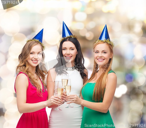 Image of smiling women holding glasses of sparkling wine