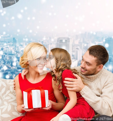 Image of happy family with gift box