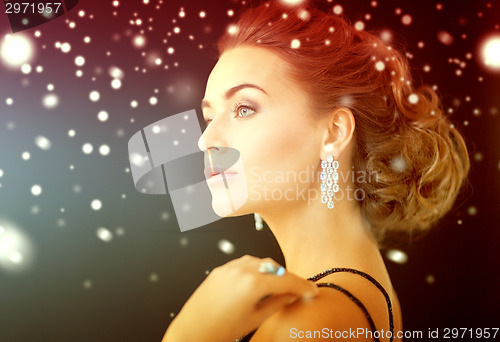 Image of woman with diamond earrings