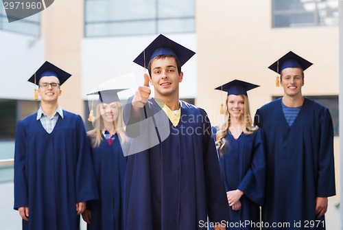 Image of group of smiling students in mortarboards